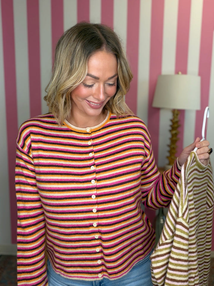woman standing in a striped sweater