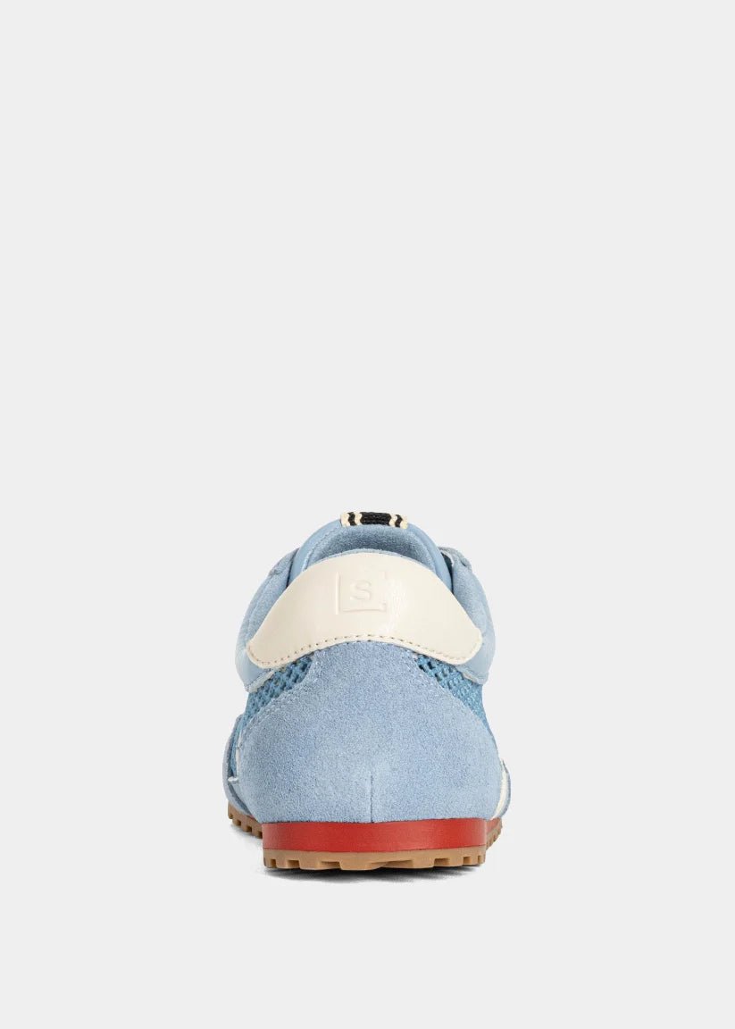 Light blue shoe with a white sole on a light gray background