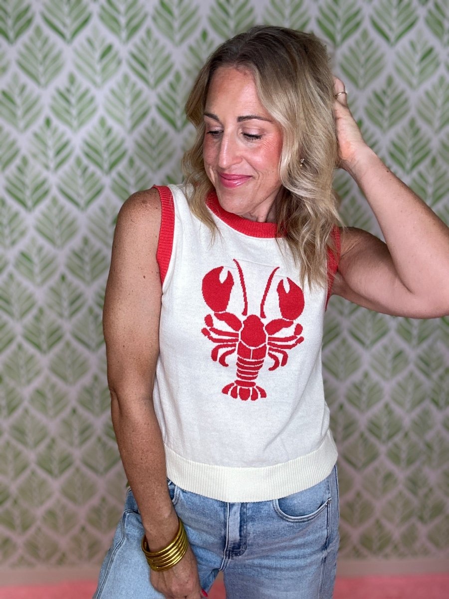 woman standing in a lobster sweater