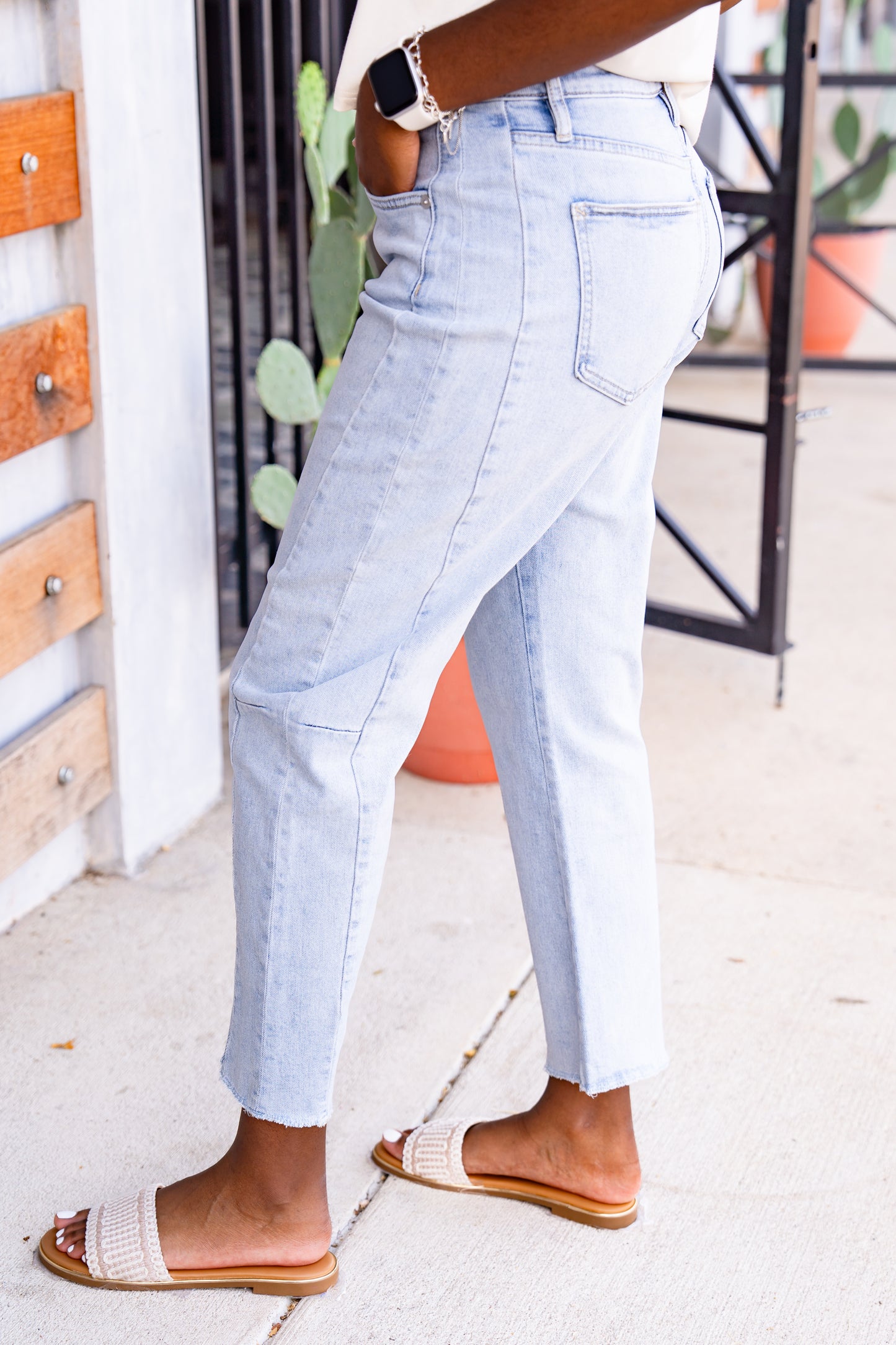 Light blue jeans worn by a person with a blurred background