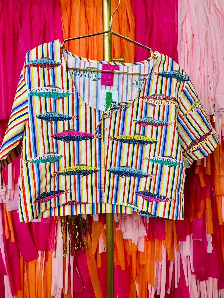 Colorful striped shirt on a hanger against a vibrant background