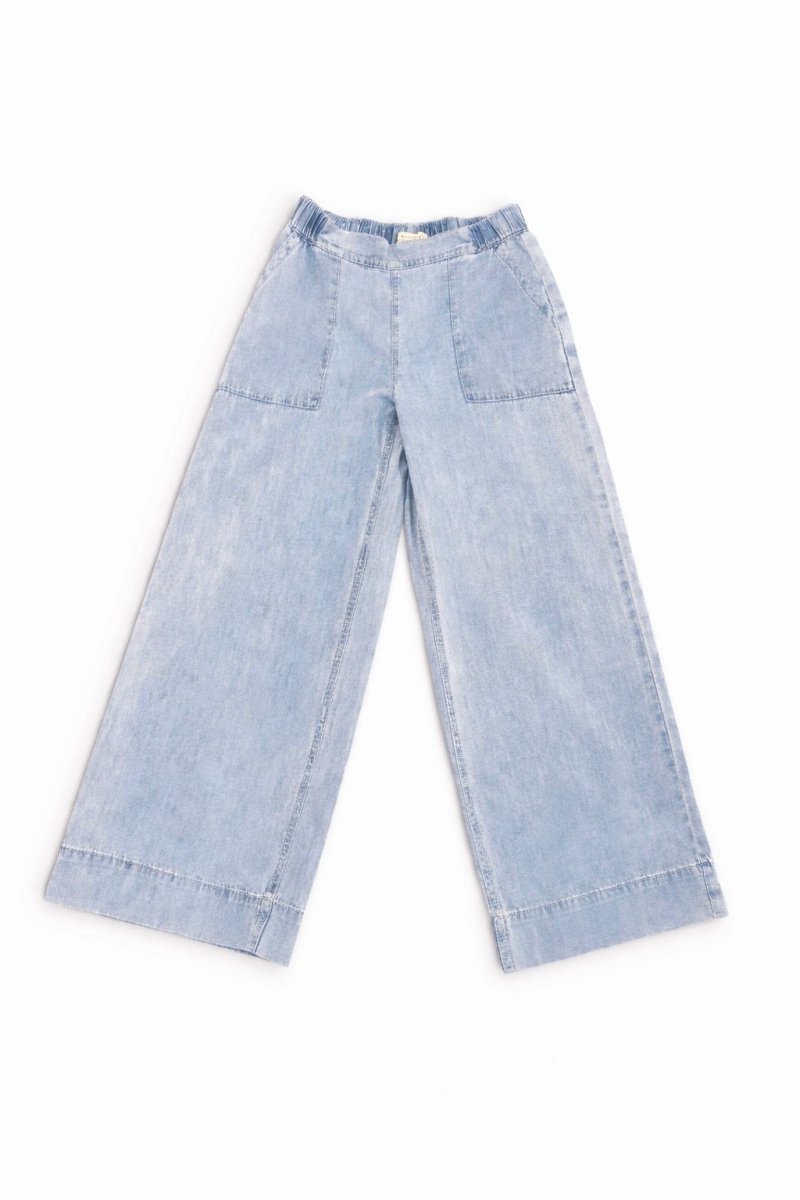 Light blue denim pants on a white background
