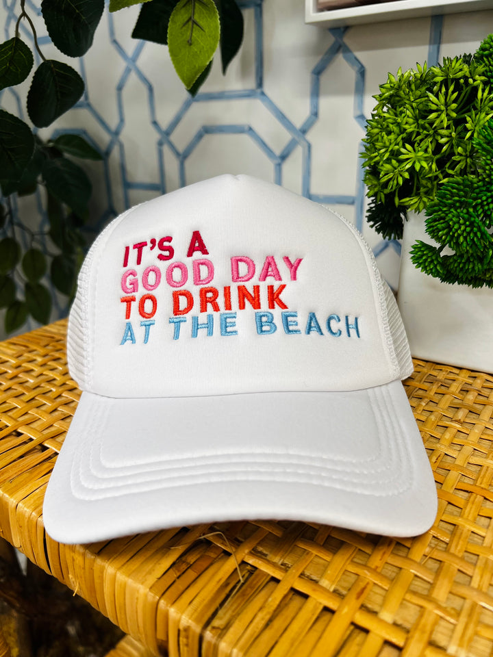 The White Drink On The Beach Trucker Hat