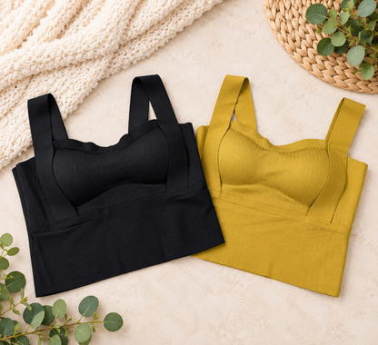 two tank tops on a blanket