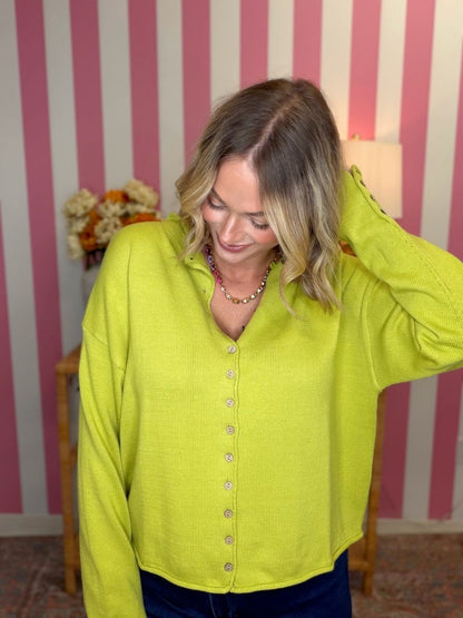 woman standing in a bright yellow sweater