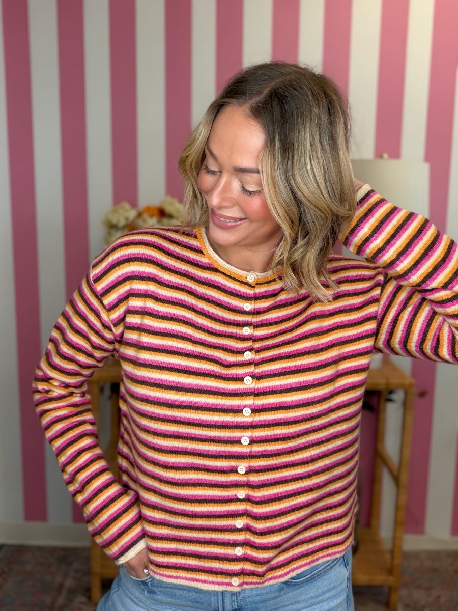 woman standing in a striped sweater