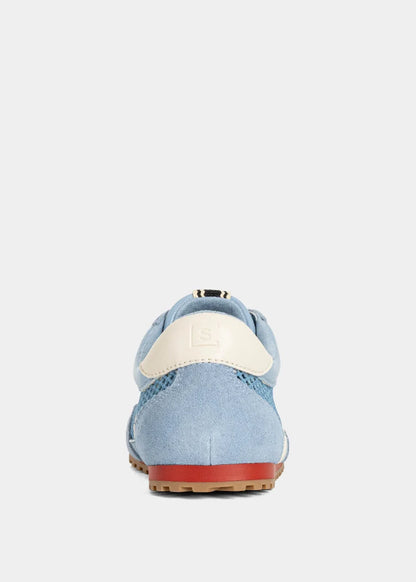 Light blue shoe with a white sole on a light gray background