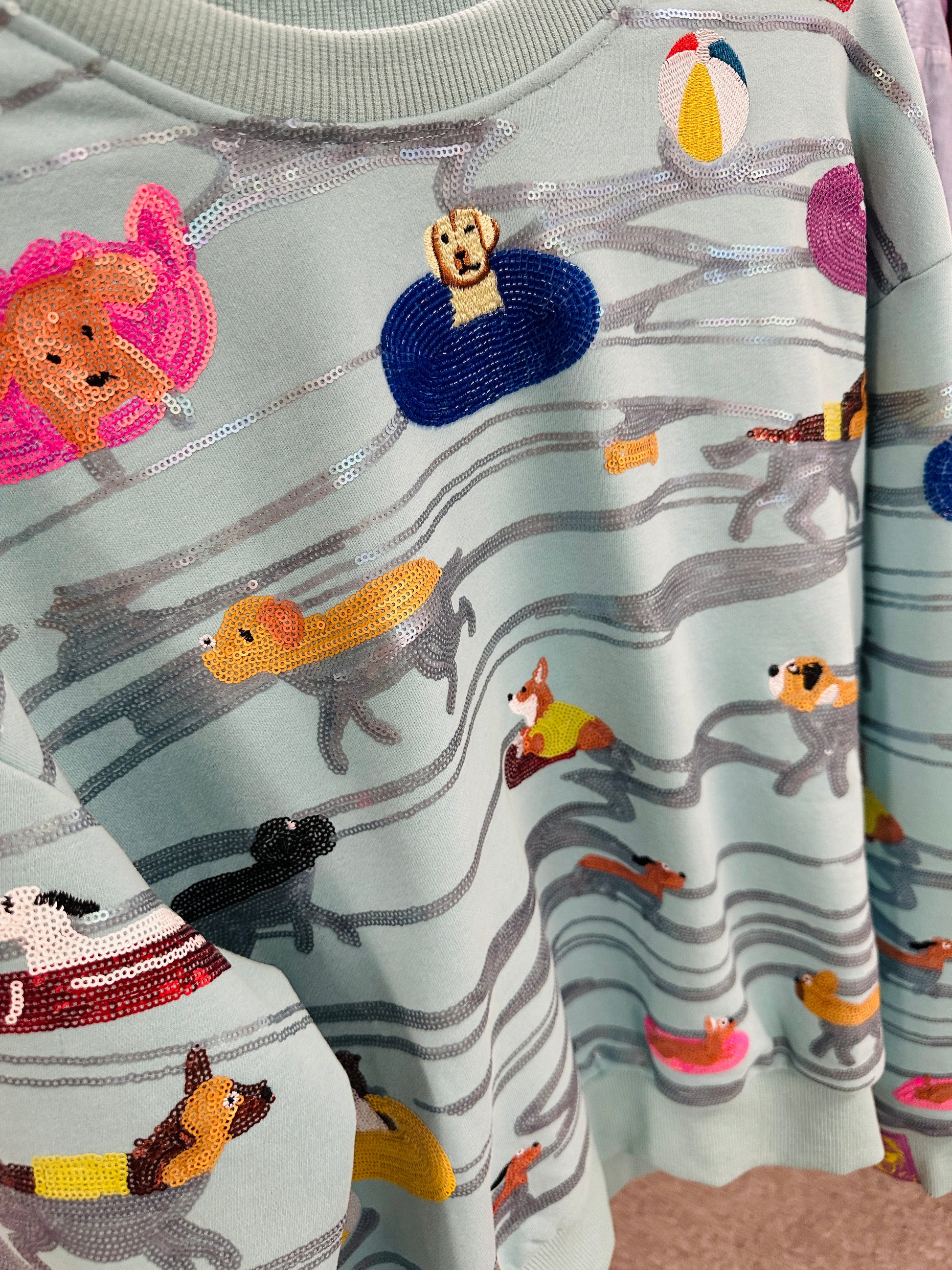 clothing with embroidered dog designs on a patterned background