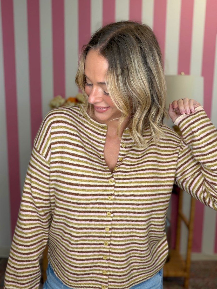 woman standing in a striped sweater
