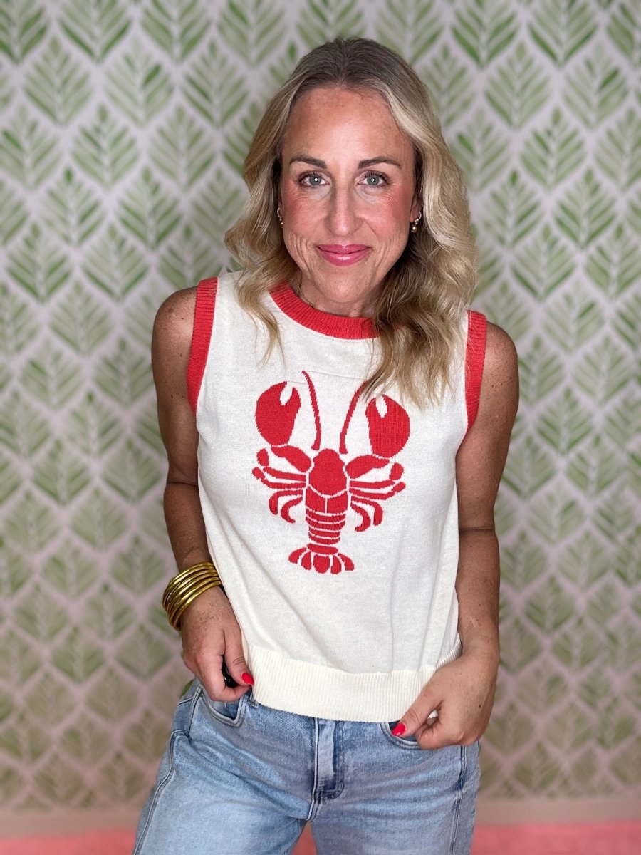 woman standing in a lobster sweater