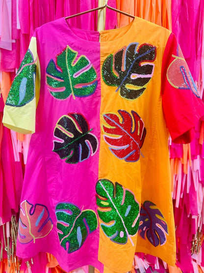 colorful dress in front of colorful wall