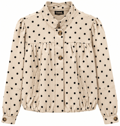 A beige long-sleeve button-up jacket with black polka dots, featuring a high collar, gathered waist, and decorative brown buttons, shown against a plain white background.