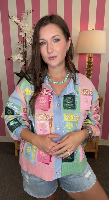 Woman wearing a colorful patchwork jacket with a striped wall background